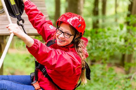 Child Reaching Platform Climbing In High Rope Course Stock Image