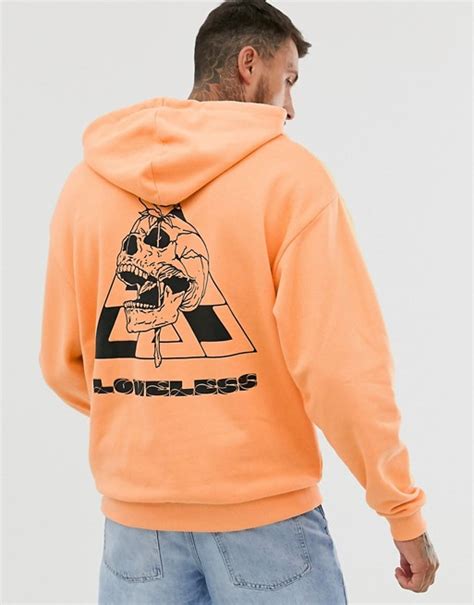 Asos Design Oversized Hoodie In Orange With Skull Back Print Asos