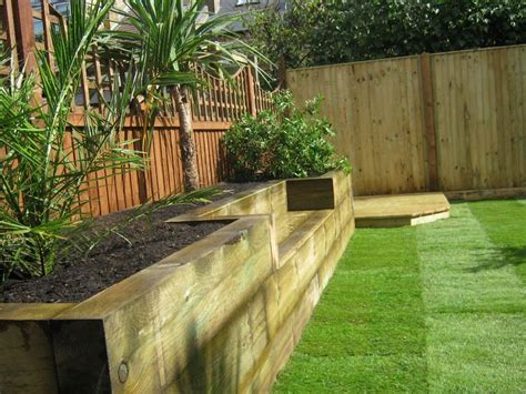 What should i put under my raised garden beds? raised flower bed with the built in bench - just what I ...