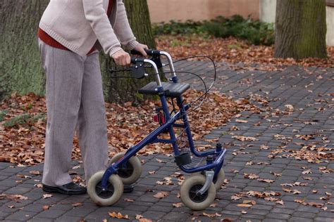 Disabled Walking With Walker Outdoors Stock Photo Image Of Adult