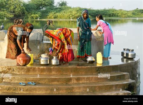 Women Draw Water From A Mir Village Well Near Dasada Gujarat India