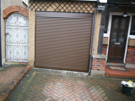 ■ residential steel panel doors. SWS SeceuroGlide Manual Garage Door in brown. This door ...