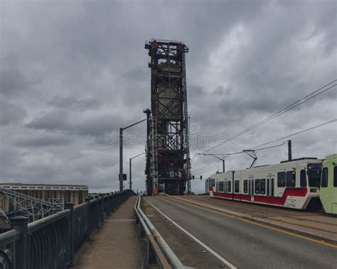 Steel Bridge Over Willamette River With Tram In Downtown Portland Usa