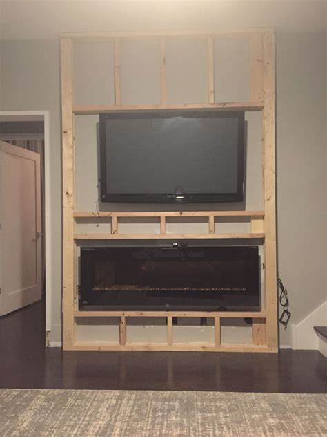 Made with wood, skamotec 225 and stone tiles. The wall of…..success??? | Living room tv wall, Home ...