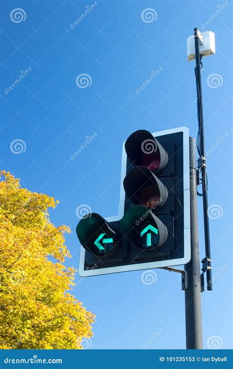 Green Go Arrows On British Traffic Lights Signal For Left Turn Stock