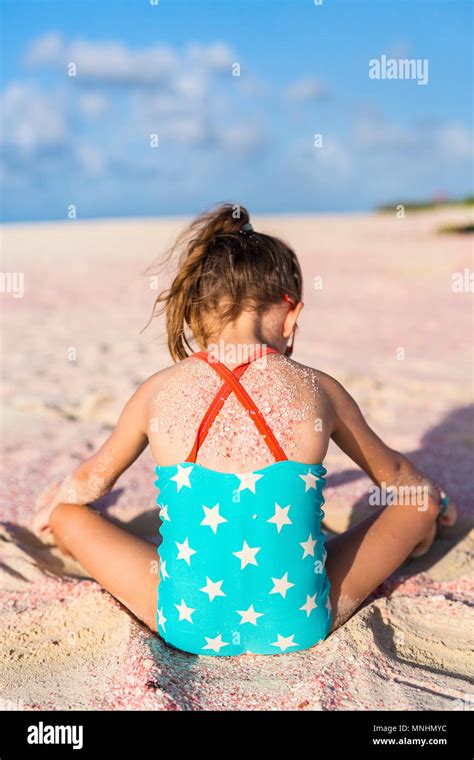 Adorable Little Girl At Pink Sand Beach During Summer Vacation Stock