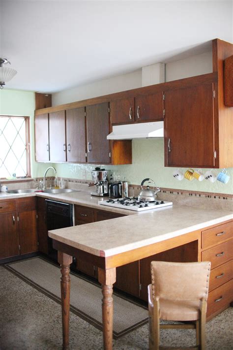 By refinishing the cabinets instead of replacing them with new we do not use plywood or veneers that are attached over your cabinets; Refinishing Kitchen Cabinets - A Beautiful Mess