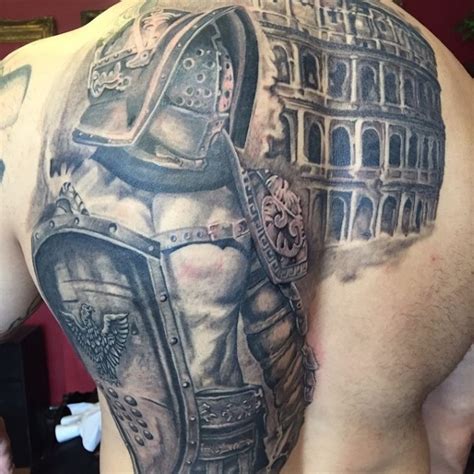 Breathtaking Very Detailed Whole Back Tattoo Of Gladiator Warrior With
