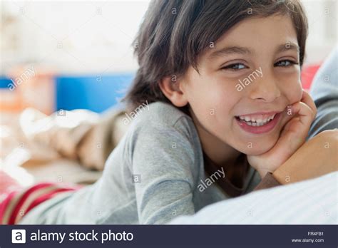 Portrait Of 4 Year Old Boy Leaning On Hand Stock Photo Alamy