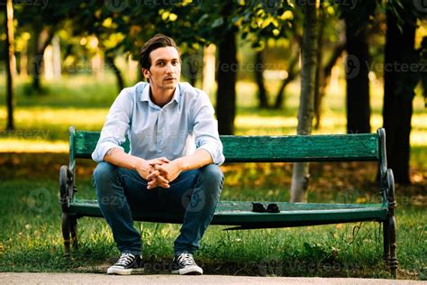 Handsome Adult Man Sitting On Bench 1106094 Stock Photo At Vecteezy