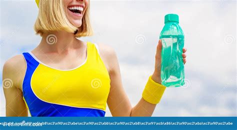 Young Woman Drinking Water After Run Woman In Sports Wear Is Holding A