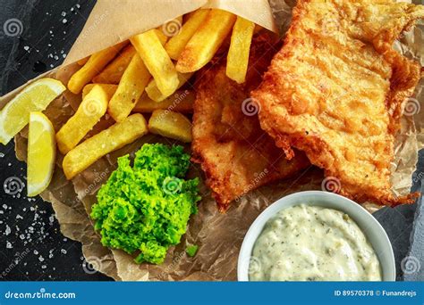 British Traditional Fish And Chips With Mashed Peas Tartar Sauce On