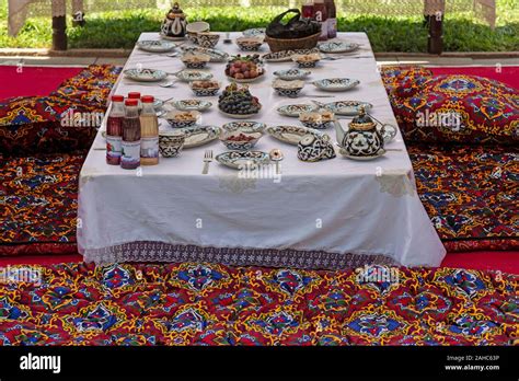 A Table Set For Traditional Uzbek Dining At A Festival Celebrating National Uzbek And Russian