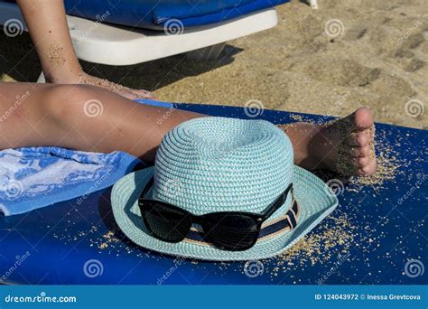 Hat And Glasses On The Beach Background A Man Is Lying On A Sun