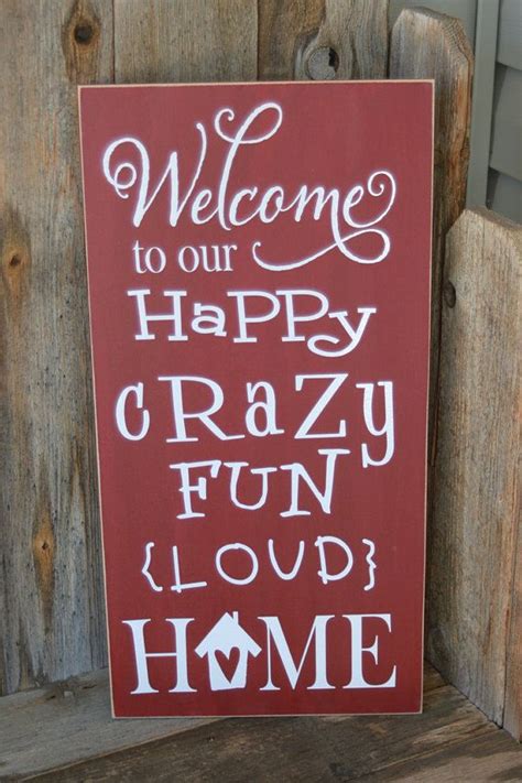 A Red Sign That Says Welcome To Our Happy Crazy Fun Loud Home On The