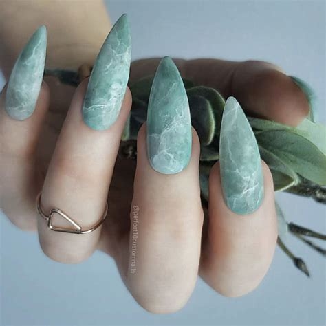 Beautiful Green Marble Almond Shaped Nails Finished With Matte Top Coat