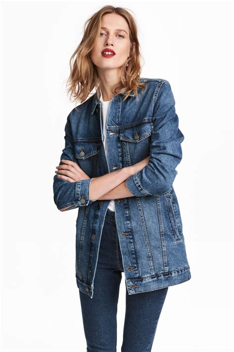 Long Jacket In Washed Denim With A Collar Buttons Down The Front Flap