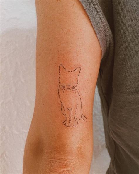 Minimalist Cat Tattoo On The Tricep