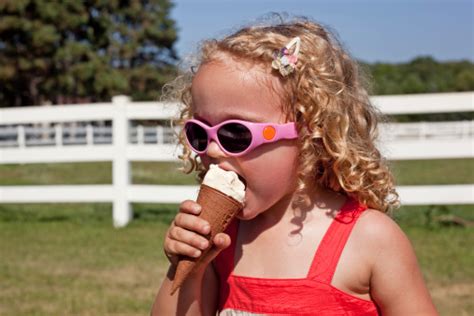 Girl Eating Ice Cream Cone Stock Photo Download Image Now Istock