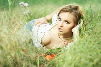 Download and buy this stock image: beautiful girl lying down of grass | People Photo | Fantero