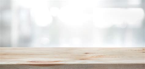 Empty of wood table top on blur of curtain with window view green from tree garden background.for montage product display or design key visual layout. Search photos table