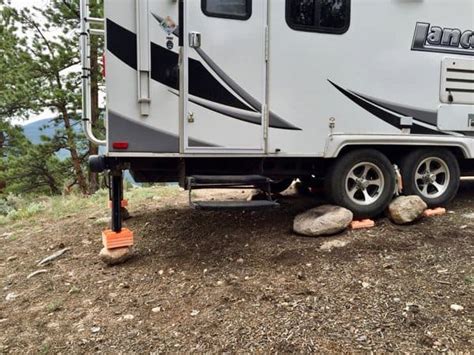 Rv stabilizer jacks are used along with leveling blocks to add stability. What are the Best RV Leveling Blocks in 2020? - Camp Addict