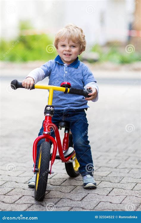 2 Years Old Toddler Riding On His First Bike Stock Photo Image Of