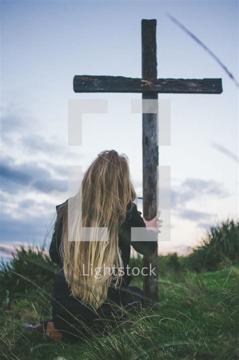 Woman Kneeling In Front Of A Cross — Photo — Lightstock