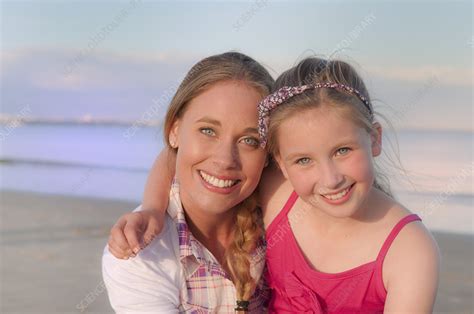 Mother And Daughter Smiling On Beach Stock Image F Science Photo Library