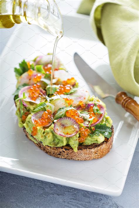 Gourmet avocado toast with caviar an | High-Quality Food Images ...
