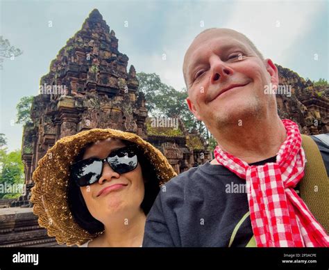A Middle Aged Couple Pose For A Selfie At The Famed And Elaborate