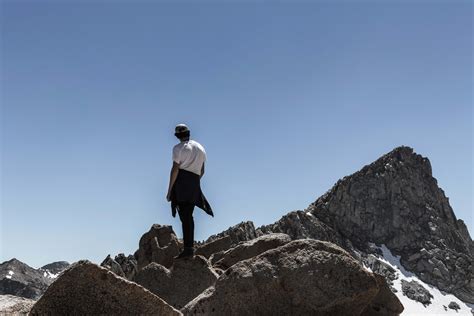 Person Man Standing On Rock Mountain Peak People Image Free Photo