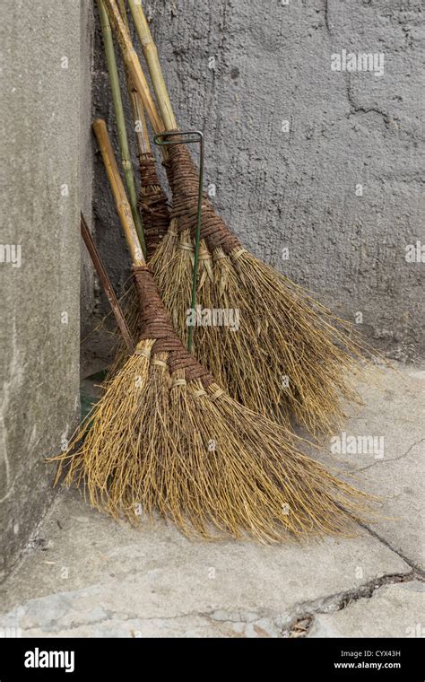 Traditional Chinese Brooms Against Stone Wall Stock Photo Alamy