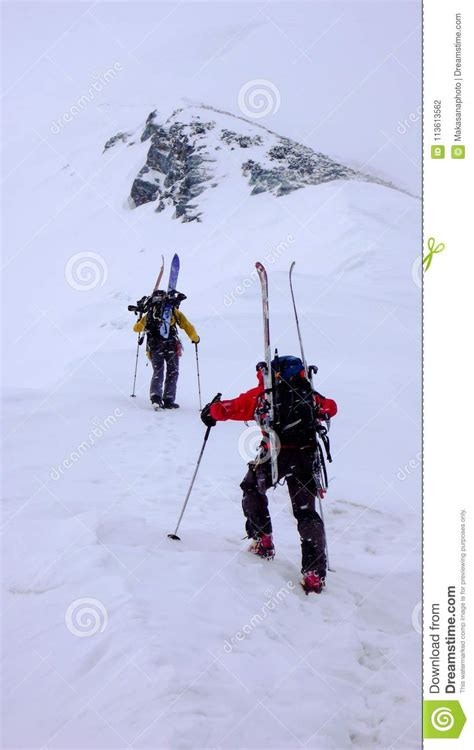 Two Male Mountain Climbers On A Backcountry Ski Mountaineering Tour In
