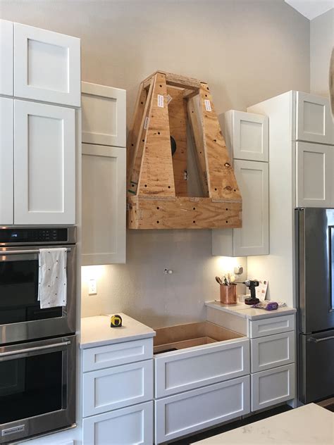 Our range is in the center of our house, so there is no way to vent it outside. DIY Wood Hood Vent | Wood hood vent, Kitchen remodel small ...