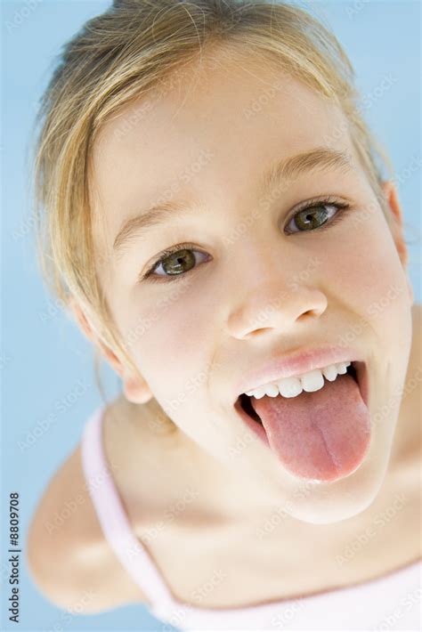 Young Girl Sticking Her Tongue Out Stock Foto Adobe Stock