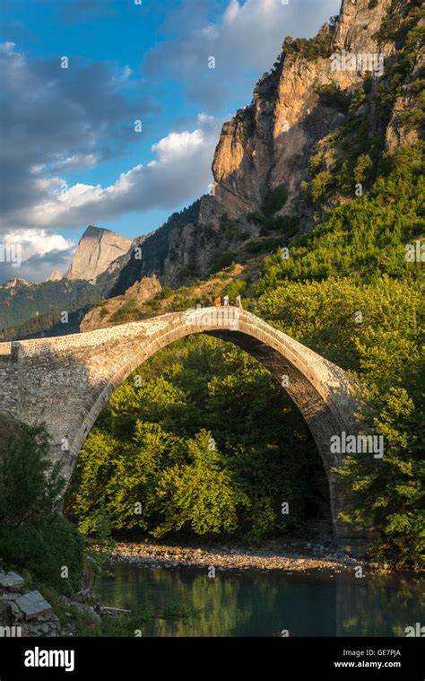 The Old Stone Bridge Across The Aoos River At Konitsa With Mount Tymfi