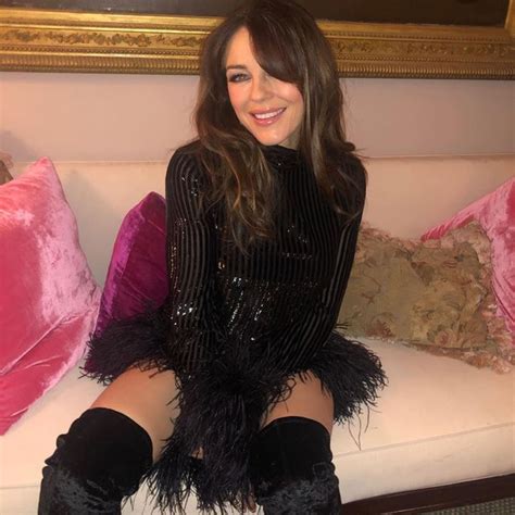 Elizabeth Hurley Puts On A Fashionable Display In Thigh High Boots And Mini Dress Celebrity