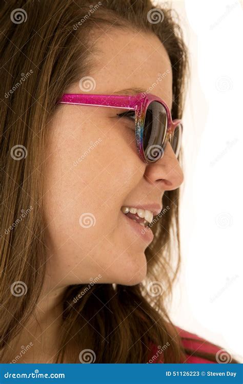 Side View Portrait Of A Young Woman Wearing Pink Sunglasses Stock Image