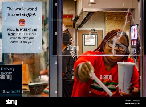 A Sign At A Burger King Drive Thru Window Encourages Patrons To Be