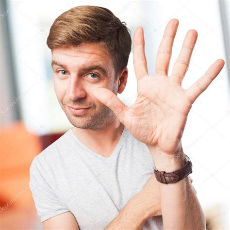 Blond Man Showing His Hand Palm — Stock Photo © Kues 72243525