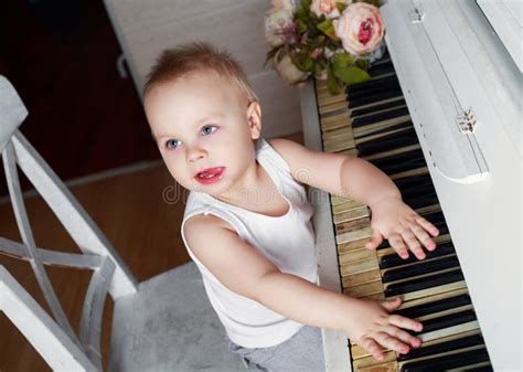 Baby Playing The Piano Stock Image Image Of Button Casual 89403011