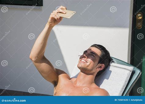 Young Man Sunbathing And Taking Selfie Picture Stock Image Image Of