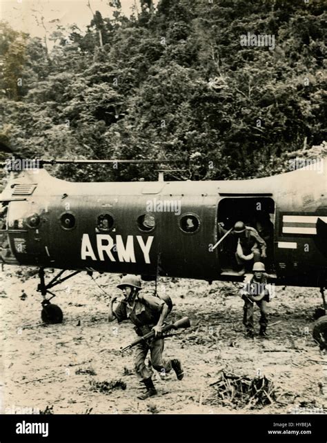 Us Commando Soldiers Getting Out Of An Helicopter Vietnam Stock Photo