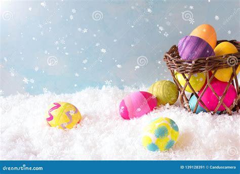 Easter Eggs And Basket In The Snow Scene Outside With Sky Background