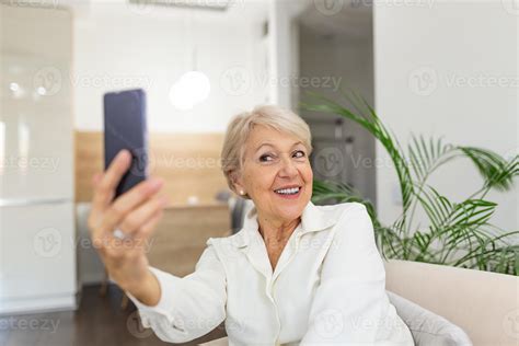 Grandma Taking Selfies At Home In The Livingroom Close Up Portrait Of