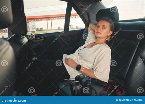 Woman Is Sitting In The Back Seat Of The Car Stock Image Image Of Driving Knees
