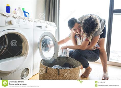 Lesbian Couple Doing Laundry Together Stock Image Image Of Live