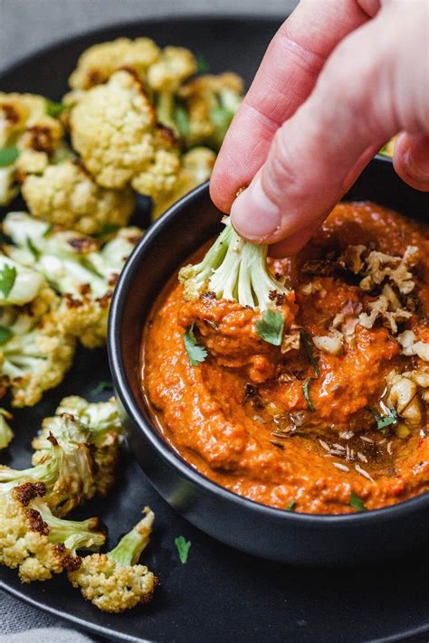 To plunge briefly into a liquid, as in order to wet, coat, or saturate. Muhammara Dip (red pepper and walnut spread) | Olive & Mango