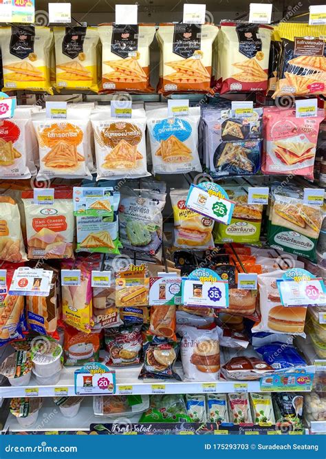 Many Pack Of Food Hanging On Shelf In The 7 Eleven Editorial Stock